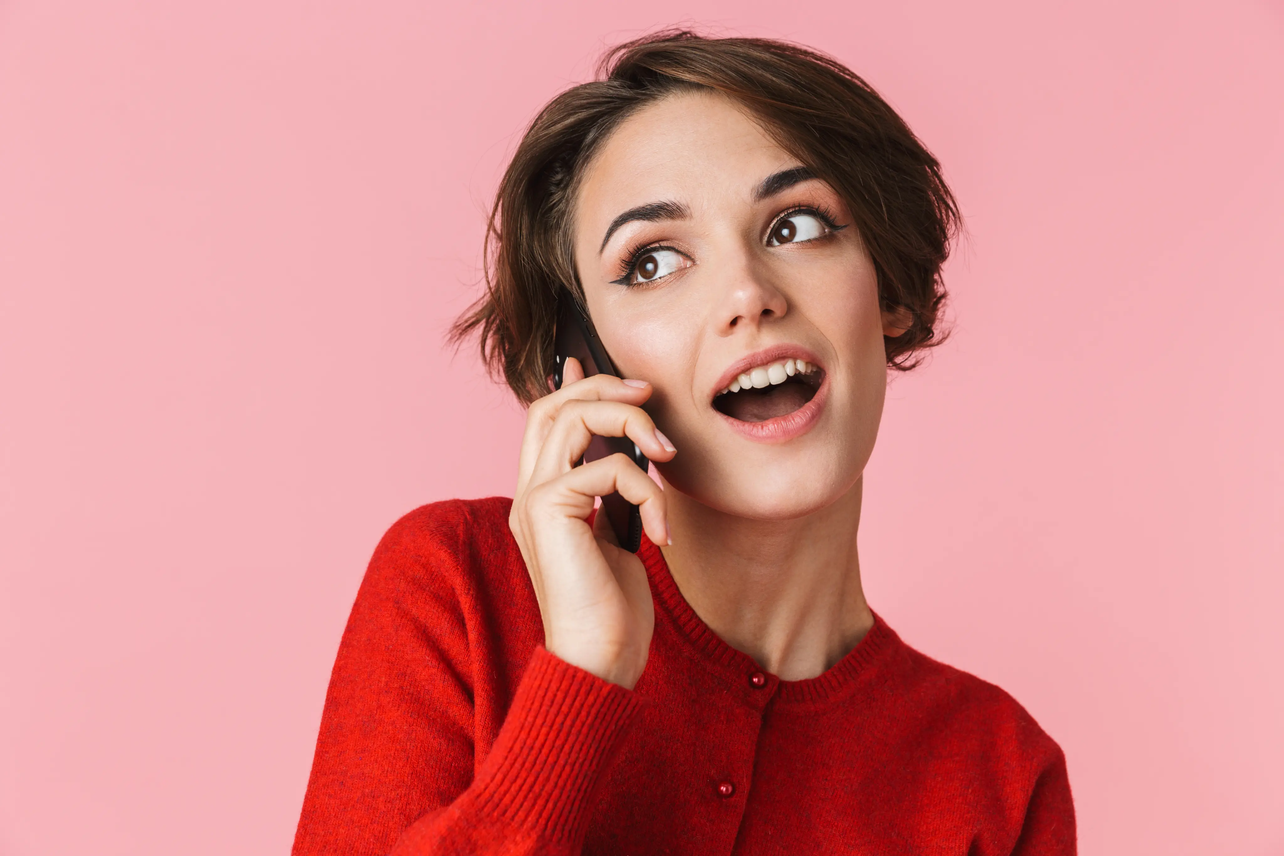 portrait-beautiful-young-woman-wearing-red-clothes-standing-isolated-talking-mobile-phone